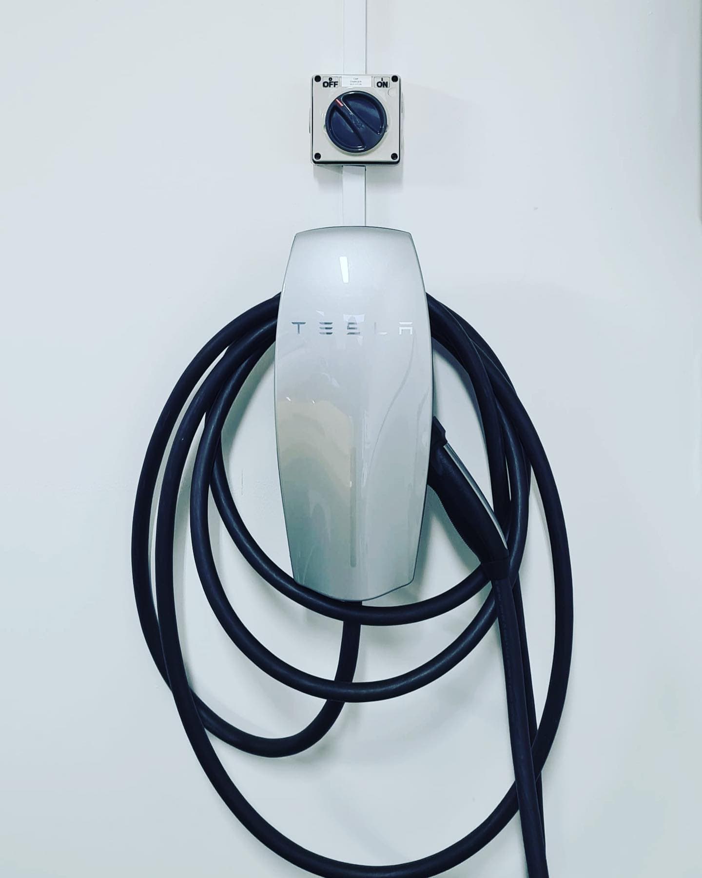 Tesla Wall Connector with isolator — clean garage install