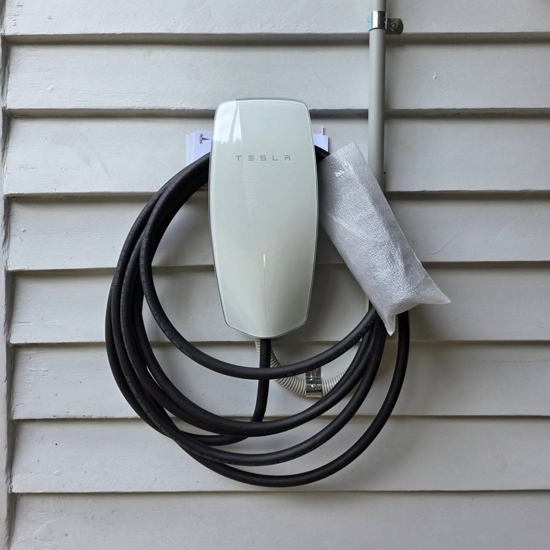Tesla Wall Connector outdoor installation on weatherboard